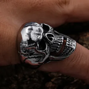 Macro detail of a vintage stainless steel skull ring with a realistic bone texture finish.