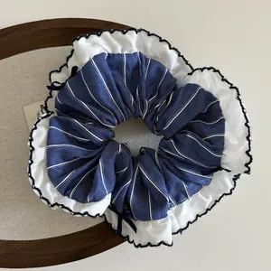 Elegant navy blue pinstripe scrunchie with white ruffled lace edge detail