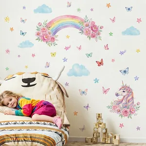Watercolor rainbow and unicorn wall decals in a cozy children's nursery room scene