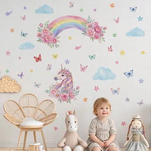 Watercolor pink unicorn and floral rainbow wall decals in a cozy children's room setting