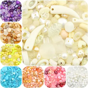 Assorted colorful DIY craft beads for jewelry making including pearls and resin shapes