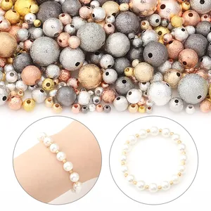 Detailed view of assorted frosted metallic spacer beads and finished pearl bracelet