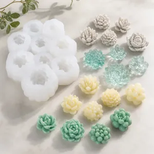 Succulent candle silicone molds set with finished wax succulent samples on marble