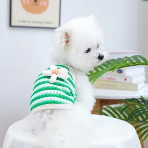 Detailed view of green striped dog vest with 3D flower embellishment