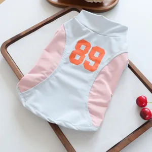 Close-up detail of sporty breathable pet vest with orange eighty-nine number print