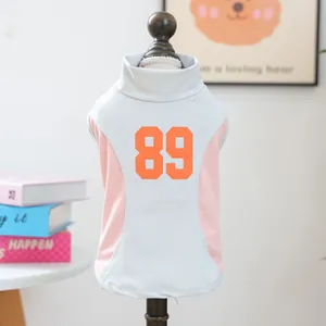 Back detail view of a breathable light blue mesh dog vest with orange number 89 print