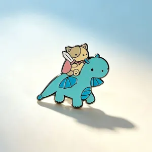 Close-up of a cute cat knight riding a blue dragon enamel pin lapel badge accessory