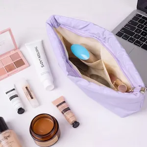 Large capacity lavender Japanese style minimalist cosmetic storage bag staged with makeup props