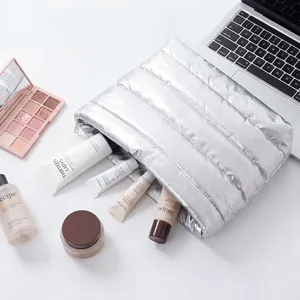 Large silver quilted cosmetic storage bag for skincare and makeup organization