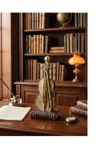 Vintage bronze violin sculpture on book base for elegant classic home study desk decor