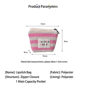Detailed view of small striped portable makeup bag showing dimensions and fabric specs