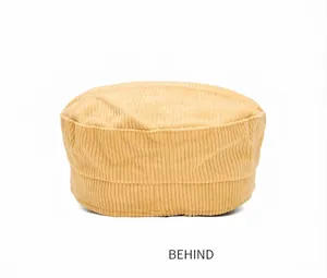 Back view of a beige corduroy flat top newsboy hat featuring classic striped texture