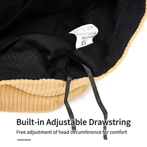 Detailed interior view of a corduroy flat top navy hat with adjustable drawstring and label.