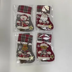 Detailed view of 4pcs checkered Christmas stockings with character appliques in plastic bags.