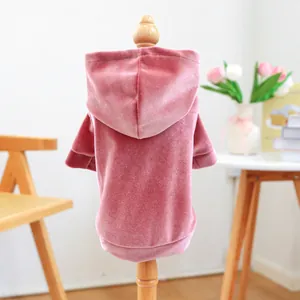 Detailed back view of a pink velvet pet hoodie on a display mannequin.