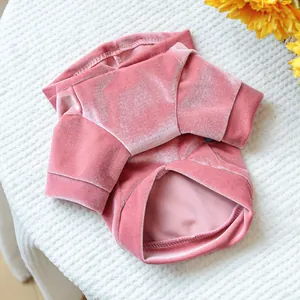 Soft pink velvet pet dress showing premium fabric texture and delicate professional stitching.