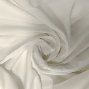 Detailed close-up of high-quality breathable white fabric texture for summer dress