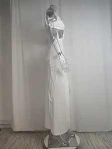 Side view of elegant white one-shoulder split maxi dress displayed on a clear mannequin
