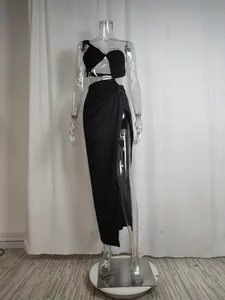 Detailed view of the black one-shoulder cut-out maxi dress featuring a high side slit