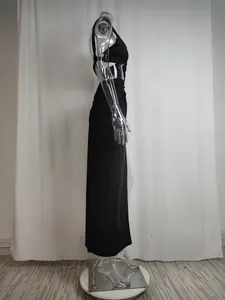 Side view of a black one-shoulder cutout maxi dress on a transparent mannequin.