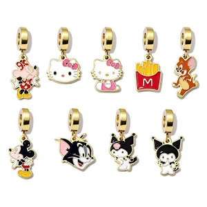Macro detail of various cartoon character enamel charms including Hello Kitty and Mickey Mouse