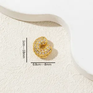 Detailed macro shot of a gold-toned pavé zircon letter C charm with dimensions.