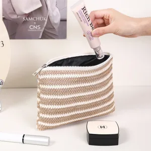 Minimalist beige and white striped woven cosmetic bag for multi-functional travel storage