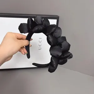 Elegant black satin padded floral headband with wide band design for women's hair