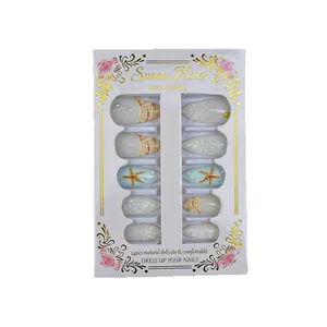 Premium handmade ocean-themed press-on nails featuring delicate pearl and starfish designs