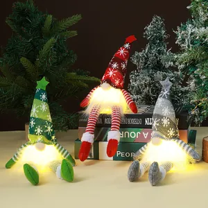 Glowing Christmas gnomes with knitted hats set in a festive scene with trees and lights.