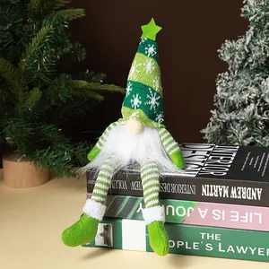 Handmade knitted Christmas gnome doll with glowing internal light and snowflake pattern hat