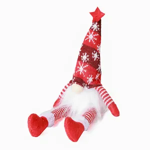 Luminous sitting Christmas gnome with red snowflake knitted hat and white beard