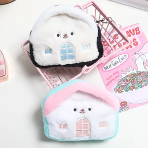 Two creative house-shaped plush coin purses and storage bags shown in a pink basket