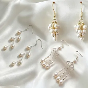 Detailed view of handmade pearl earrings crafted with DIY jewelry findings.