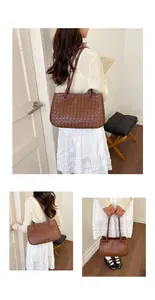 Brown woven leather shoulder bag styled with a white dress and a beige cardigan