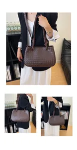 Detailed look of chocolate brown woven handbag styled with a black blazer and white dress