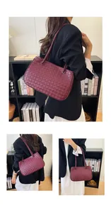 Close-up view of a burgundy woven leather shoulder bag with minimalist design