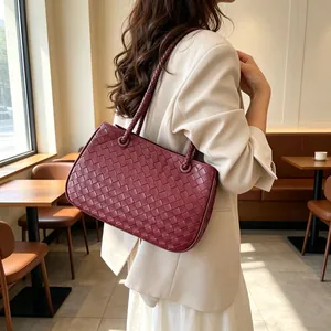 Stylish burgundy woven tote bag for women featuring classic Intrecciato leather pattern