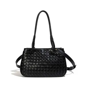 Elegant black woven leather shoulder bag for women with minimalist fashion design