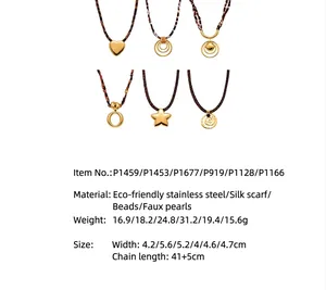 Detail of leopard print silk scarf necklaces with gold geometric stainless steel pendants.