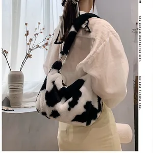 Stylish plush cow print underarm bag for women, soft faux fur shoulder bag in a trendy look