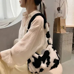 Trendy plush cow print underarm bag for women, stylish winter shoulder bag accessory