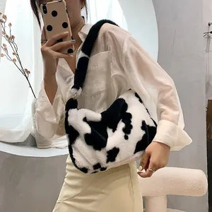 Stylish cow print plush underarm bag made of soft faux fur for autumn and winter