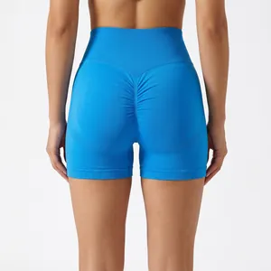 High-waist seamless scrunch butt yoga shorts in vibrant blue for gym and running.