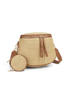 Detail of woven straw bum bag with matching coin purse and brown leather trim