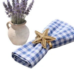 Elegant gold starfish napkin ring ocean themed metal holder for coastal dining decor