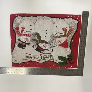 Festive knitted Christmas placemat featuring snowman design with measurement rulers