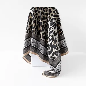 Leopard print imitation silk square scarf with ornamental paisley border design