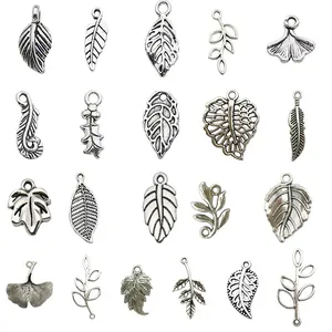 Collection of vintage silver alloy leaf and feather charms for DIY jewelry making