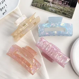 Iridescent acetate-style large hair claw clips for women in assorted mermaid colors